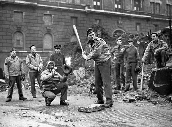 American soldiers playing baseball amid the ruins in the business centre of Liverpool