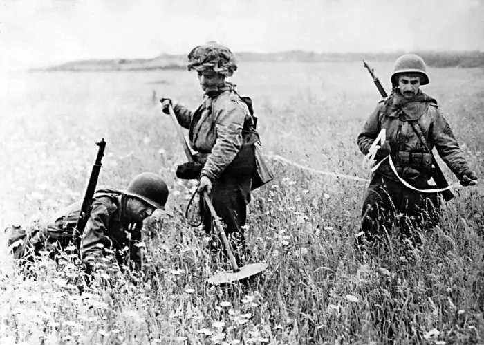 Framed Print : American soldiers searching a field in Northern France for landmines