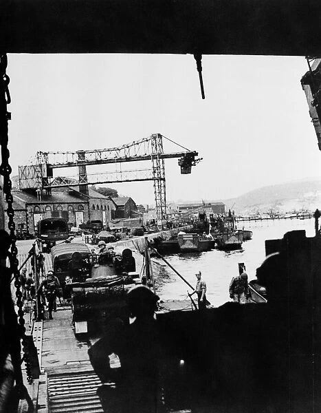 American troops and equipment are loaded on to LST (Landing ship tank