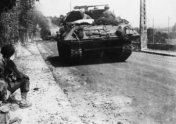 Americans Pass By Blazing German Armour. En route to Paris toad in the liberation