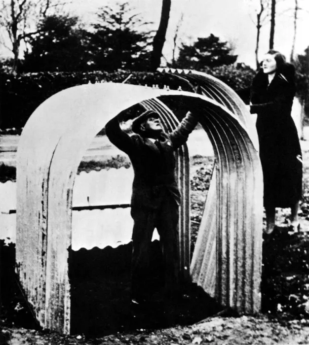 Framed Print : An Anderson air raid shelter under construction in a garden. Circa: 1939 Framed Print : An Anderson air raid shelter under construction in a garden. Circa: 1939