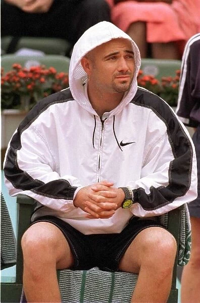 Andre Agassi tennis star in action in the rain during the French Open tennis tournament
