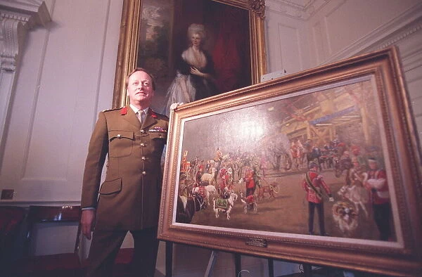 ANDREW PARKER-BOWLES WITH THE PAINTING PRESENTED TO HIM ON HIS