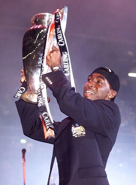 Andy Cole celebrating with the League trophy May 1999 in Manchester Arena as