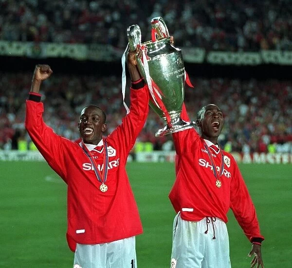 Andy Cole and Dwight Yorke Manchester United players with trophy after