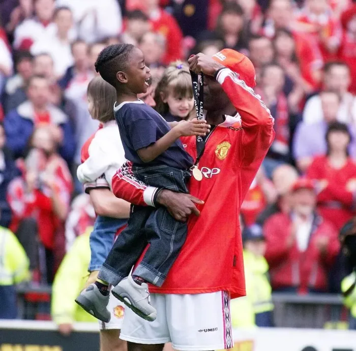Framed Print : Andy Cole Football player for Manchester United May 1999 showing his son Devante Framed Print : Andy Cole Football player for Manchester United May 1999 showing his son Devante