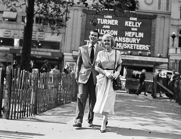 Angela Lansbury and Peter Shaw, pictured walking in Leicester Square