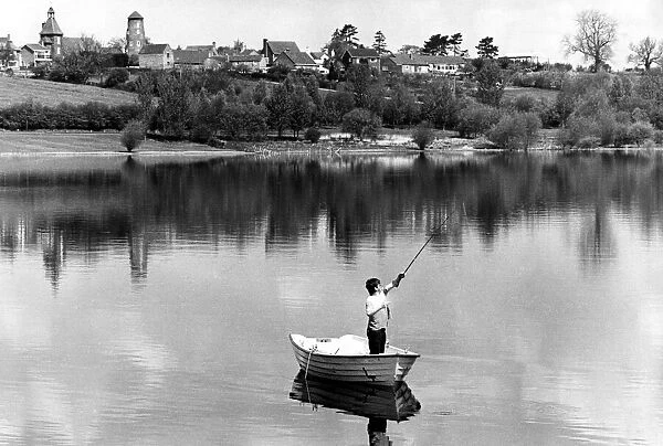 Angling. The village of Thurlaston gazes down on Draycote Water on a balmy day in May