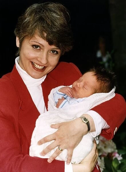Anne Diamond TV Presenter holding baby