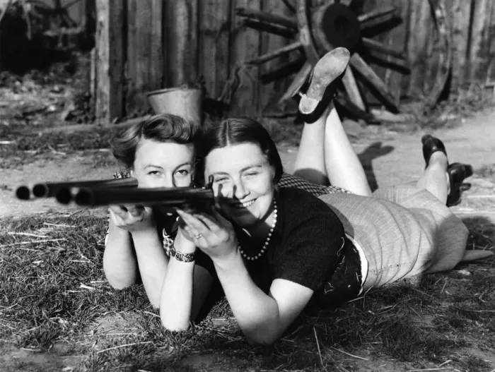 Framed Print : Annie get your gun: A couple of young Kent farmers wives learn how to aim Framed Print : Annie get your gun: A couple of young Kent farmers wives learn how to aim