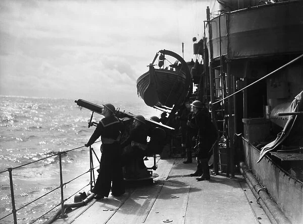 Anti aircraft drill aboard a Royal Navy cruiser of the Home Fleet seen here on exercise