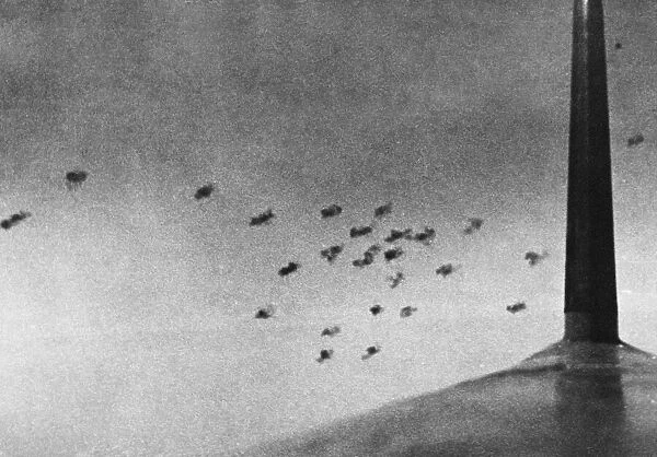 Anti-aircraft shells burst over Southern England trying to repel another air raid by