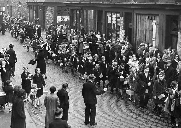 Anxious parents scan the large crowd of pupils of the Sacred Heart School in Liverpool