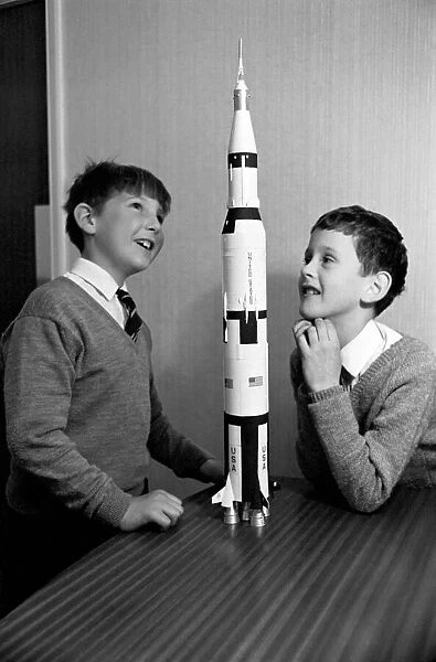 Apollo 12 moon rocket model on display. L to R, Paul Ward