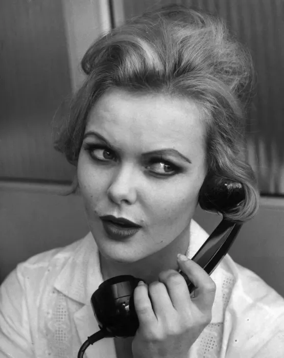 Framed Print : Applying Make up lessons with Jocylyne Wiseman. Woman talking on the telephone
