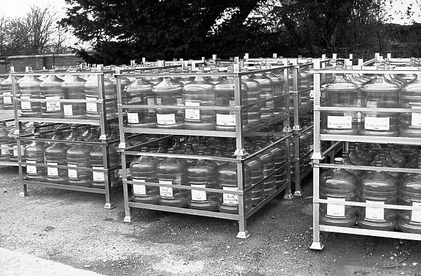 Aqua Trading Company 6th March 1989. Demijohns waiting to be filled for transport to