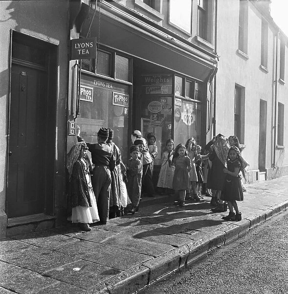 Arab children gather outside a general store on their way to attend the Peel Street