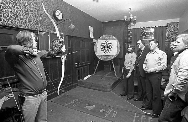 Archers challenge darts players to a game of darts, with the Archers using their bows