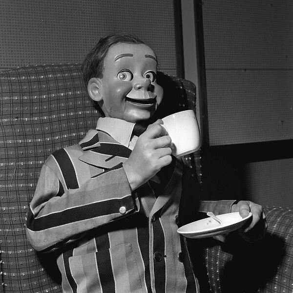 Archie Andrews 1958 ventriloquists dummy drinking from cup holding saucer