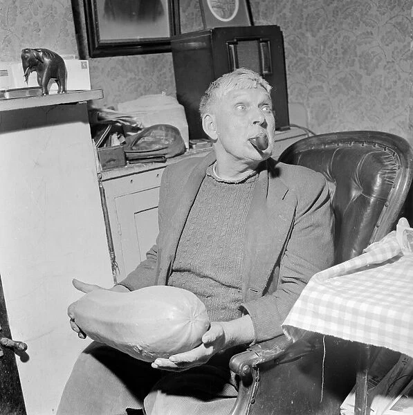 Archie Haffenden seen here enjoying his pipe and holding his prize marrow Circa