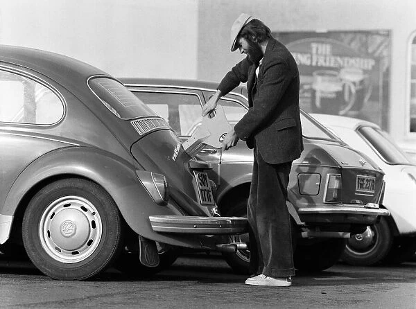 Architectural student Vic Lock, 26, of Kidderminster, winds up his 11-year-old Volkswagen