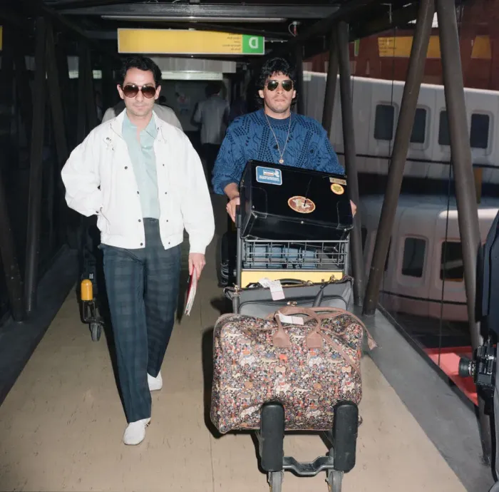 Framed Print : Argentina footballers Diego Maradona is met by his friend