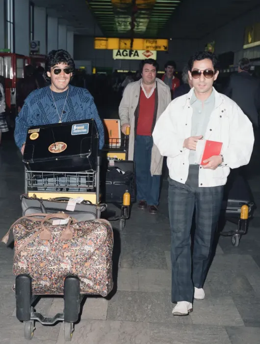 Framed Print : Argentina footballers Diego Maradona is met by his friend Framed Print : Argentina footballers Diego Maradona is met by his friend