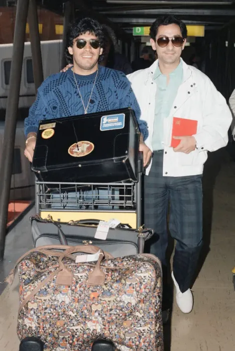 Framed Print : Argentina footballers Diego Maradona is met by his friend