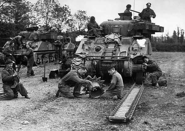 An armoured regiment overhauling one of their tanks Sherman for further battle against