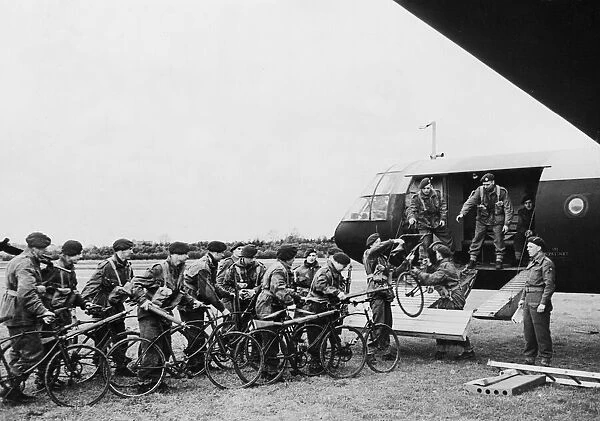 Army cyclist board a Airspeed Horsa gliders in preparation for moving off to their take