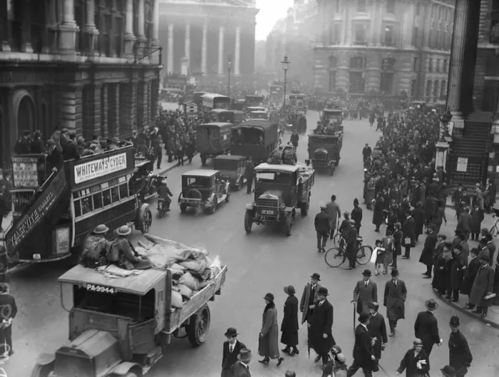Framed Print : The army escort a food convoy past commuters making their way to work near The Bank in