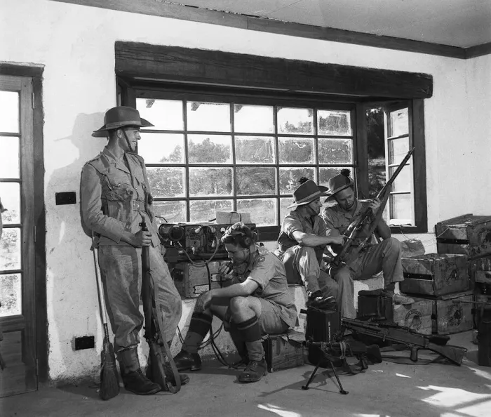Framed Print : Four Army men belonging to the Kenya Reserves in a command post up country