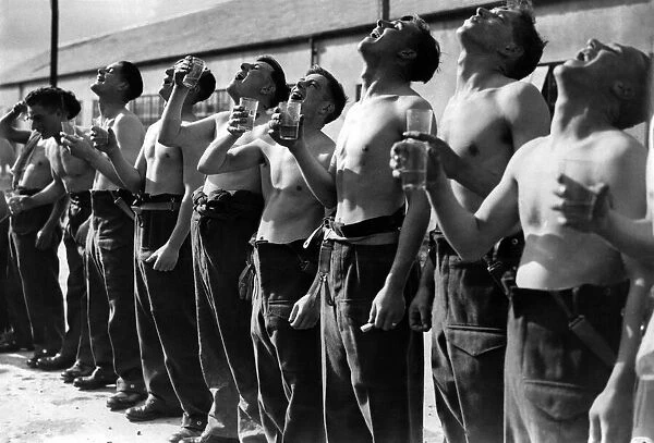 Army Recruiting: New Recruits seen here gargling with mouth washing. October 1939 P001787