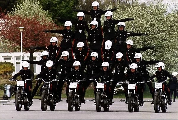Army Regiment Royal Signals White Helmets performing a human pyramid stunt on motorbikes