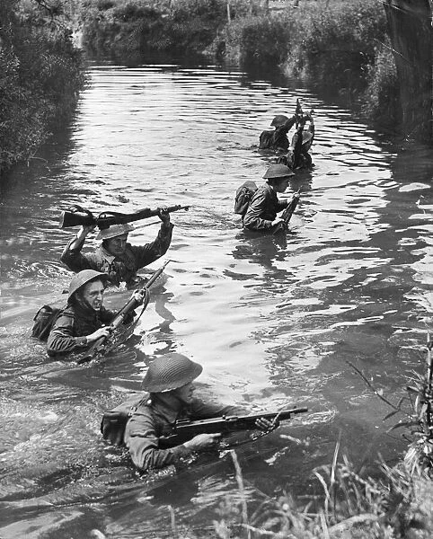 Army Training. Young NCOs (Non-commissioned officers) crossing a river