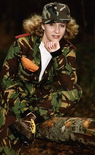 Army Women Female soldier in camouflage resting her chin on her hand - wearing