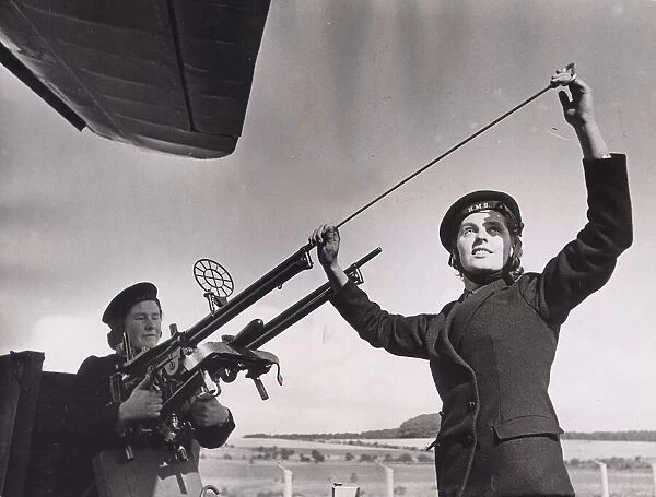 Army Women September 1942 Wren Armourer cleaning anti aircraft gun at RN Air