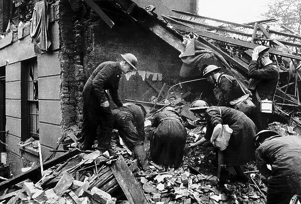 ARP and police searching a house in North West London that was wrecked by a German bomb