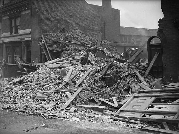 ARP and Rescue wardens sift through the rubble of the Belgravia Hotel, Balsall Heath