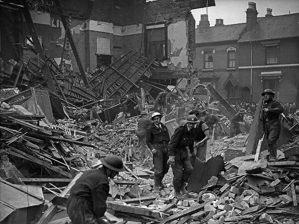 ARP and Rescue wardens sift through the rubble of the Belgravia Hotel, Balsall Heath
