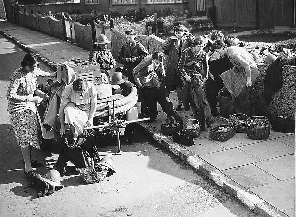 ARP women prepare for an an exercise with fire fighting equipment during WW2 1942