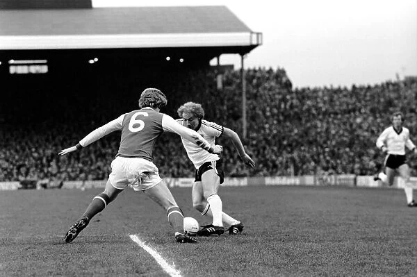 Arsenal (1) v. Ipswich (1). Alan Brazil (right) sends Willie Young the wrong way