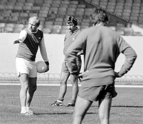 Arsenal coach Don Howe instrucing his players during a training session 9th