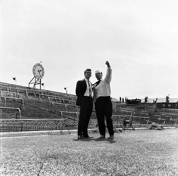 Arsenal Football Club Billy Wright talks to Joe Baker in front of the Clock End