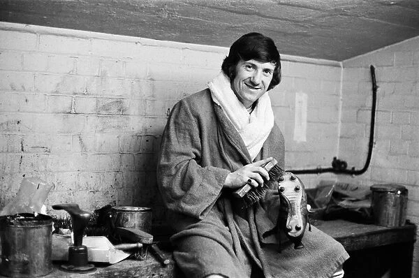 Arsenal footballer George Armstrong pictured in the boot room at Highbury football ground