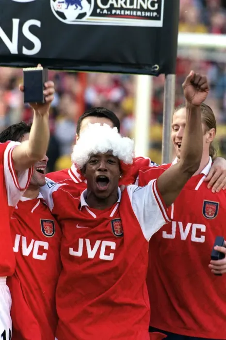 Framed Print : Arsenal footballer Ian Wright celebrates with team mates after the 4-0 victory over Framed Print : Arsenal footballer Ian Wright celebrates with team mates after the 4-0 victory over