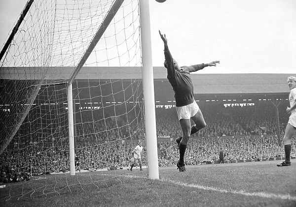 Arsenal goalkeeper Jim Furnell is powerless to stop Liverpool