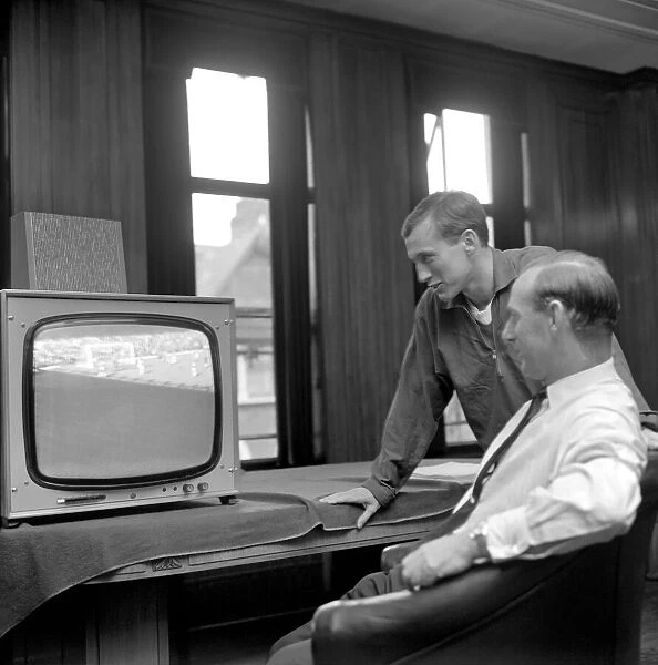 Arsenal Manager Bertie Mee and new signing Bob McNab watch T. V. October 1966 W9209-002