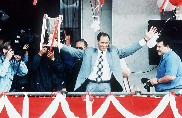 Arsenal manager George Graham shows off European cup winners cup trophy to crowds of