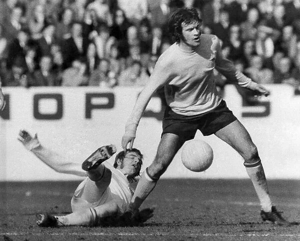 'Arsenal v. Stoke. Arsenals hero Peter Storey is tacked by Stoke defender